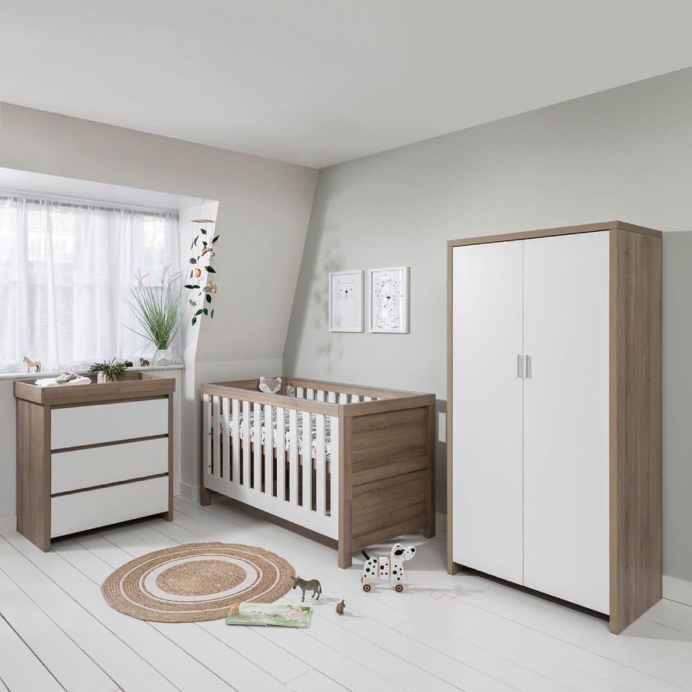 white cot and changing unit