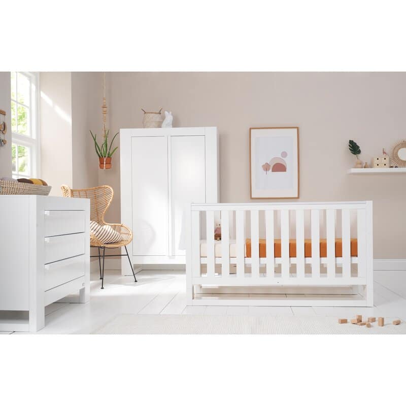 white cot and changing unit